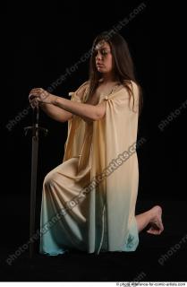 BARBORA KNEELING POSES WITH SWORD